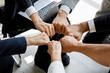 © Bangkok Click Studio - Group of multi colors hands stack together and smiling in the symbol of unity and strong teamwork.