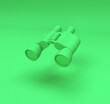 Leinwandbild Motiv Green binoculars isolated on green background with copy space