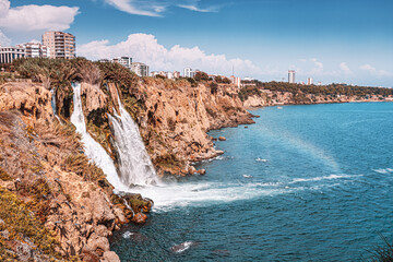Wall Mural - The picturesque and powerful Duden waterfall, a water stream breaks from a high cliff - this is a very popular place for tourists and a business card of Antalya and Turkey