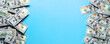 © Alex - US dollars on blue background