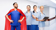 © Syda Productions - healthcare, profession and medicine concept - happy smiling male doctor in blue uniform and red superhero cape and female nurses over hospital corridor background
