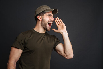 Wall Mural - Excited military unshaven man screaming and looking aside