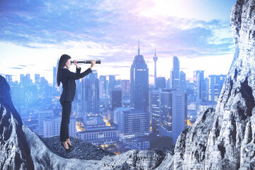 Wall Mural - Young businesswoman using telescope