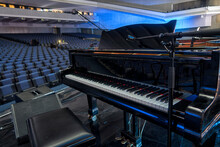 The Grand Piano Stands On The Stage Of The Concert Hall