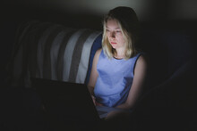 A Young Blonde Caucasian Woman College Student Is Fatigued From Staying Up All Night Staring At The Screen Of Her Laptop Computer.