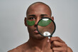 © Svitlana - Loupe in hand of multiethnic male focused on a patch