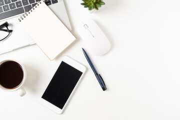 Wall Mural - white office desk table with laptop, and smartphone and pen with coffee cup, copy space, top view