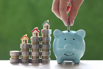 Finance, Model house on stack of coins money on natural green background, Business investment and real estate