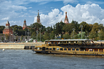 Moscow.Russia. July, 30, 2020. View of Mosow river and touristic boats floating against the background of Kremlin.