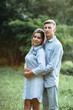 © Andriy Medvediuk - Outdoor shot of young happy couple in love on sunny day on nature. Man and woman hugging, sunlight in summer park. valentine's day. The concept holiday