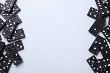 Sticker - Black domino tiles on white background, flat lay. Space for text