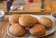 Rounded Bread is prepared as an ingredient for cooking homemade hamburger or sandwich in kitchen.
