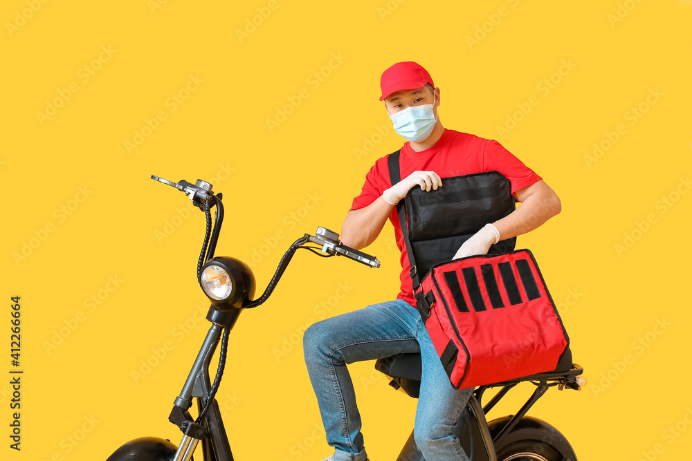Courier of food delivery service on color background