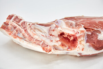 A piece of fresh raw meat pulp on a white background, isolated. The concept of cooking dishes from fresh meat, beef, bones, the best restaurant, delicious cuisine