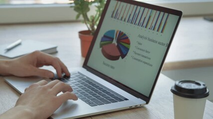 Wall Mural - close up. business man using a laptop to view business information .