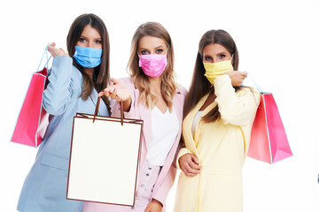 Poster - Three women in pastel suits holding shopping bags over white background