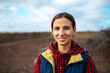 © Lalandrew - Outdoor portrait of young smiling girl on blurred background of sky and field.