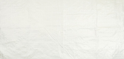 white woven plastic bag texture background. polypropylene sack cloth surface.