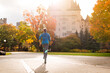 © blurMEDIA/Stocksy - Young Woman Jogging In Ottawa Near Fairmont ChÔøΩÔøΩteau Laurier in Autumn