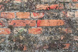 Old rustic red brick wall with concrete textured facade background