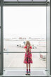 © blurMEDIA/Stocksy - Little Girl Excited Travel and Flight at Modern Airport Traveller Lounge