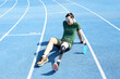 © Guille Faingold/Stocksy - Happy sportsman with prosthesis after workout on track.