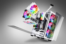 Exploded View Of White Gaming Pc Computer With Glass Windows And Rainbow Rgb LED Lights. Flying Hardware Components Abstract Concept Technology Gray Background