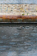 © Rialto Images/Stocksy - Detail of building exterior and peeling paint on old garage door