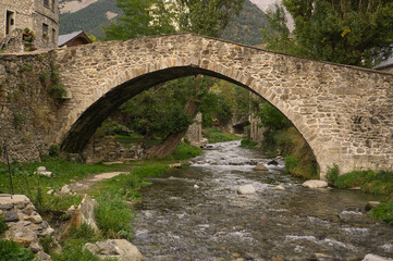 Stone bridge in Sallent de Gallego town, located in Hueca, Aragon, Spain.