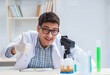 © Elnur - Young chemist student working in lab on chemicals