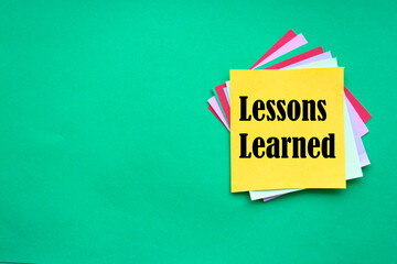 lessons learned write on sticky notes, education concept