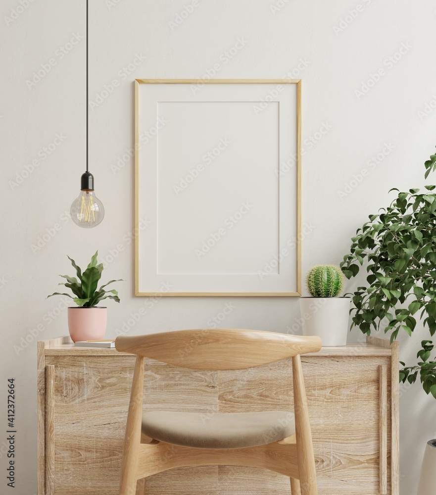 Mockup frame on work table in living room interior on empty white wall background. - obrazy, fototapety, plakaty 