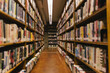 © Raymond Forbes LLC/Stocksy - Aisle in Public Library