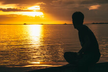 Silhouette Of A Man At Sunset In Manila Bay, Philippines