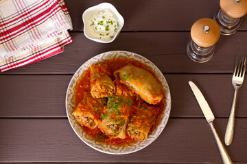 Wall Mural - Cabbage rolls with meat, rice and vegetables. Chou farci, dolma, sarma, golubtsi or golabki. View from above, top view