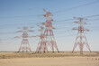 © Mauro Grigollo Photographer/Stocksy - power pylons in the Desert, United Arab Emirates