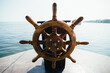 © AlejandroMCB photo & film/Stocksy - Old boat steering wheel in the sea. Kerala backwaters, India.