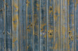 © Peter Meciar/Stocksy - Old wooden wall with a ragged color