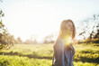 © Rob and Julia Campbell/Stocksy - happy, thoughtful teen girl enjoying nature at sunset
