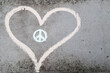 © Mellimage/Stocksy - Heart and peace symbol on grey concrete