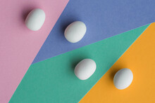 White Egg Shaped Candies On A Colorful Background