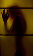the dark silhouette of a girl in the doorway