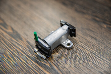 engine chain tensioner on wooden background