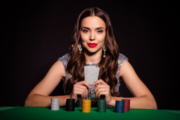 Poster - Photo of classy chic pretty lady sit casino table hold two cards wear glossy dress isolated black color background