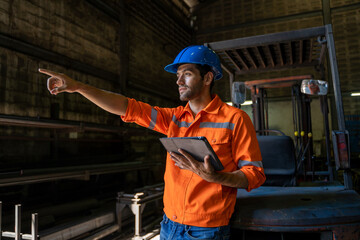 Poster - Engineer uses tablet checking production process  in the Industry workplace Factory.
