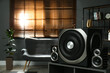 © New Africa - Modern audio speaker system on wooden table in living room