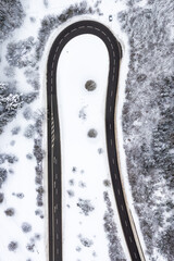 Wall Mural - Winter snow winding road Serpentine season aerial photo view near Albstadt portrait format