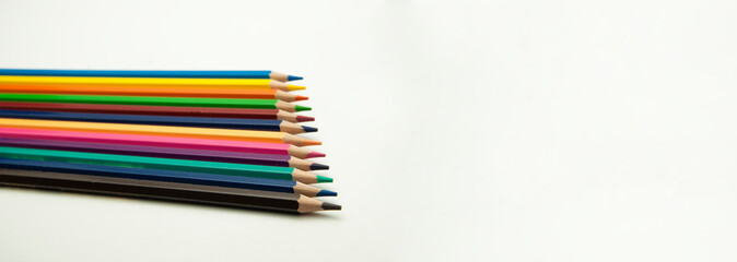 colored pencils on a white background. education concept. illustration of training.