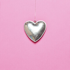 Wall Mural - Heart shape decoration on pink background. Valentine love concept.