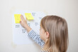 © Julija - A great math activity for child - busy toddler. Little girl playing number match game.